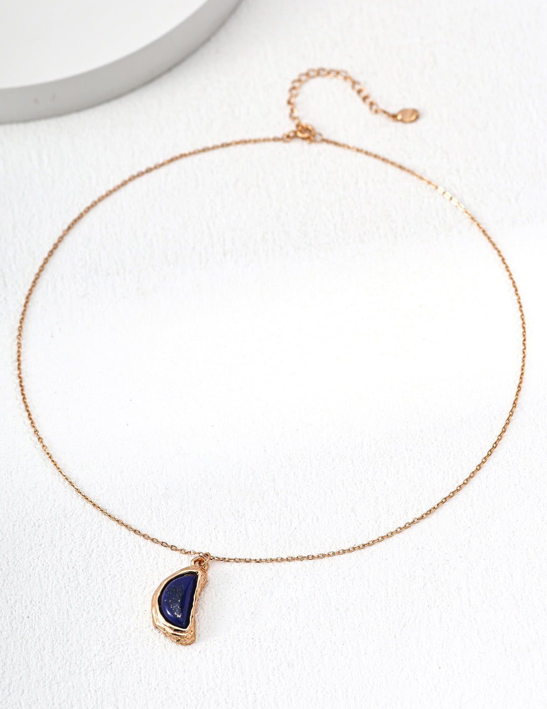 Dare To Sparkle - Vintage gold arc pendant necklace with natural blue lapis lazuli stone and organic textured molten framing