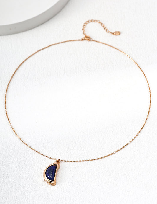 Dare To Sparkle - Vintage gold arc pendant necklace with natural blue lapis lazuli stone and organic textured molten framing