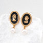 Dare To Sparkle - Vintage gold queen cameo drop earrings with premium black enamel backdrop and dangling natural freshwater pearls