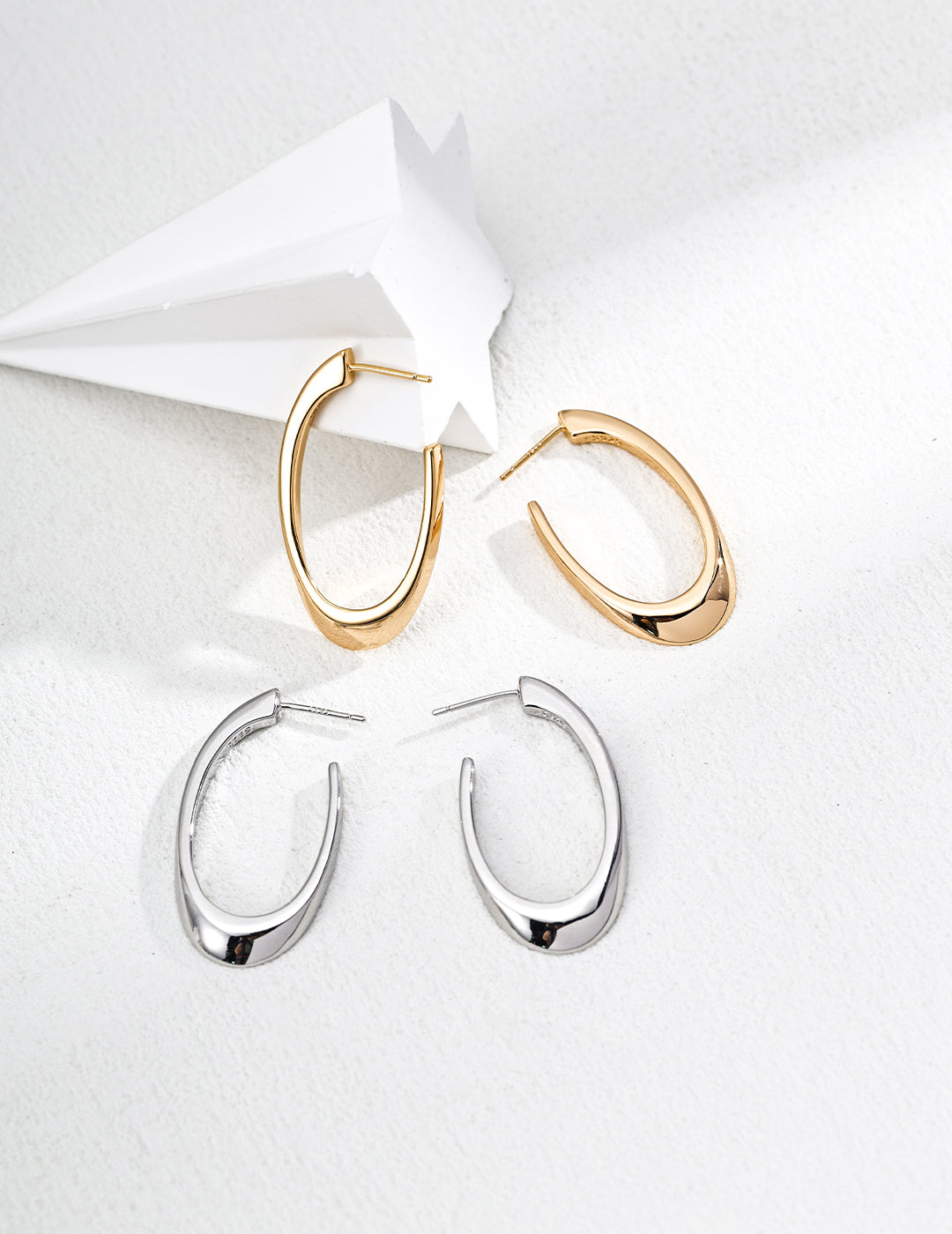 Dare To Sparkle - High-polished minimalist oval hoop earrings in premium sterling silver and 18k gold plated finishes