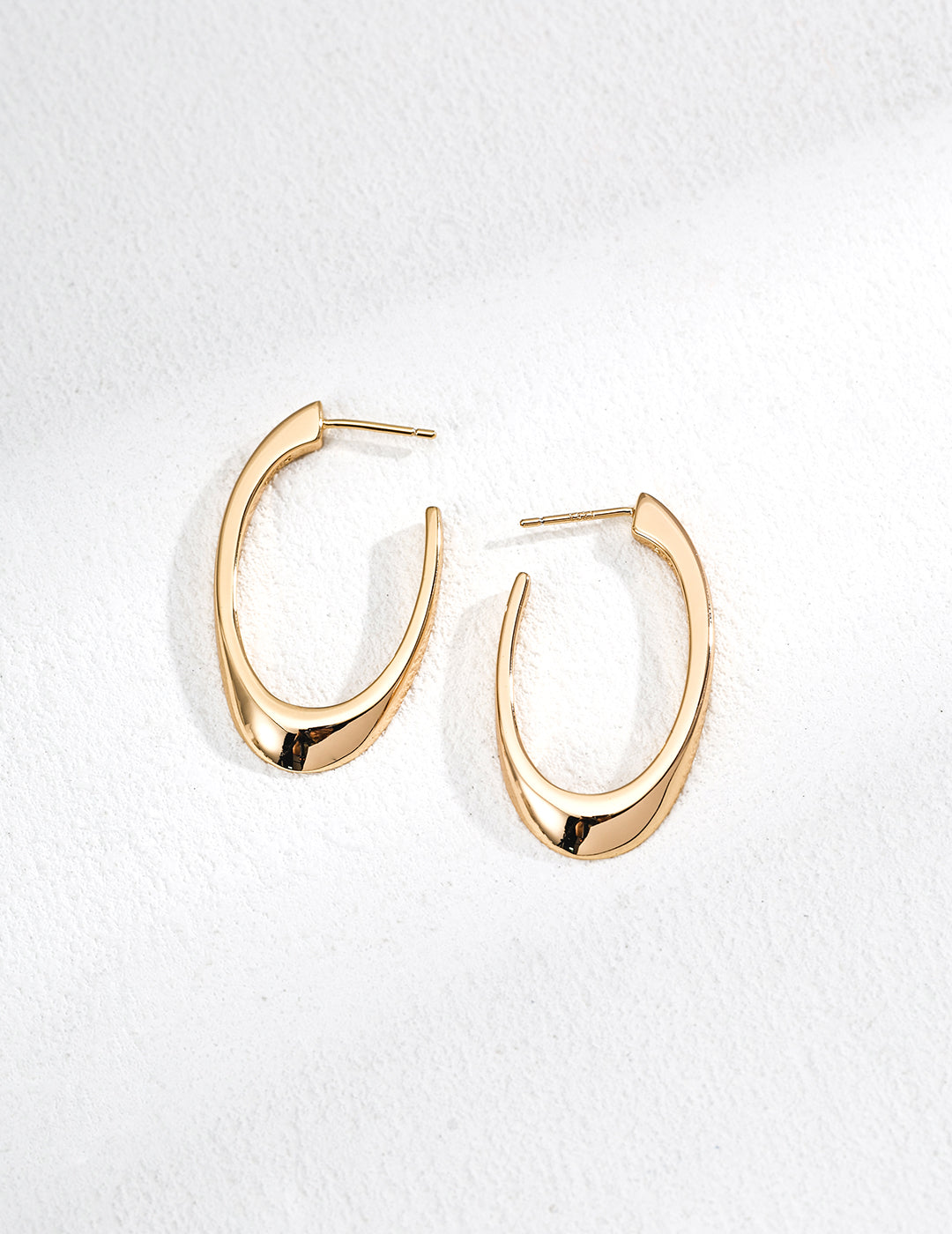 High-polished minimalist oval hoop earrings in 18k gold plated finishes
