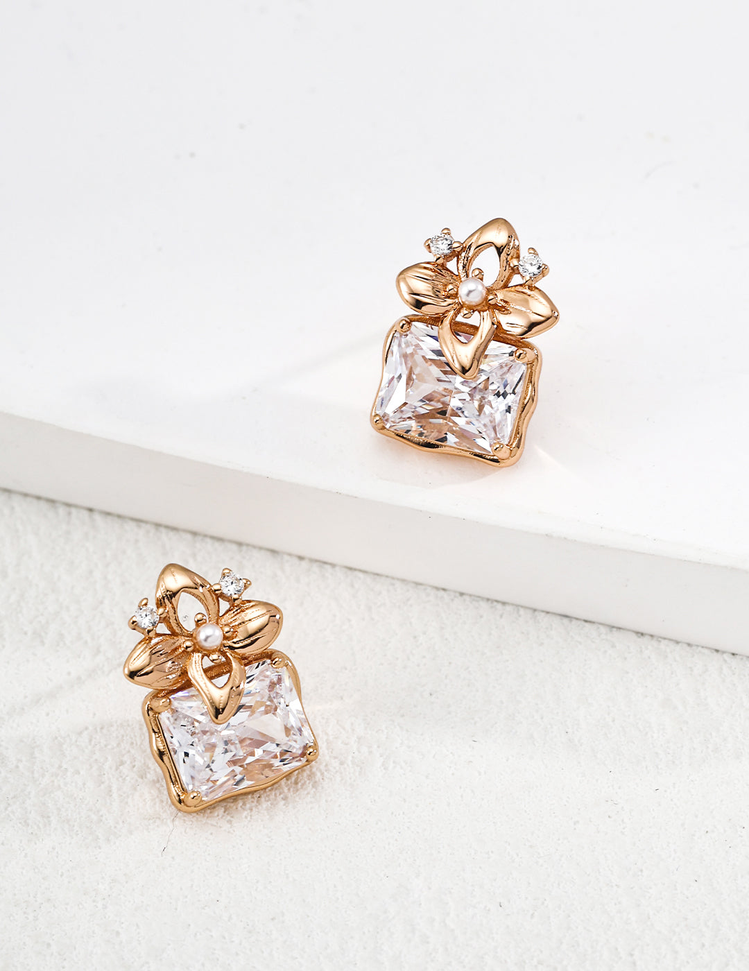 Dare To Sparkle - Glamorous gold stud earrings with a large rectangular radiant-cut cz crystal and vintage engraved floral pearl top