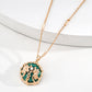 Dare To Sparkle - Vintage gold pendant necklace with a natural green malachite stone surrounded by an intricate mythical flame fluid border