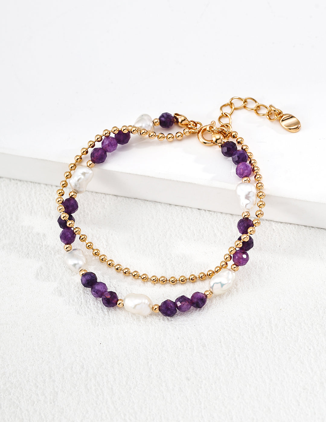Dare To Sparkle - Elegant double-strand bracelet with one layer of natural pearls and one layer of gold chain with purple amethyst gemstones