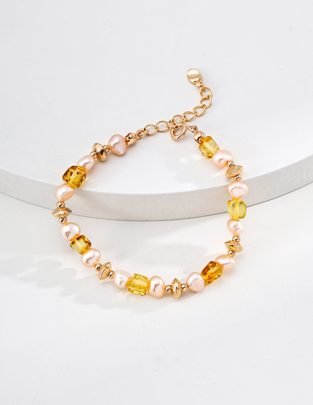 Dare To Sparkle - Elegant vintage bracelet featuring natural warm honey amber stones and lustrous champagne pearls with gold textured spacers