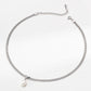 Silver necklace with a pearl pendant on a white background