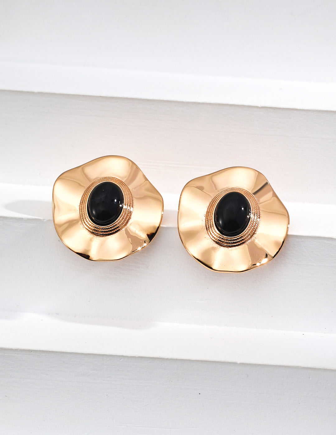 Dare To Sparkle - Regal vintage gold statement earrings featuring large wavy metallic discs centering a polished natural black onyx stone