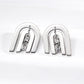 Contemporary CNC precision cut layered arch stud earrings with a central dangling cubic zirconia stone in silver finishes