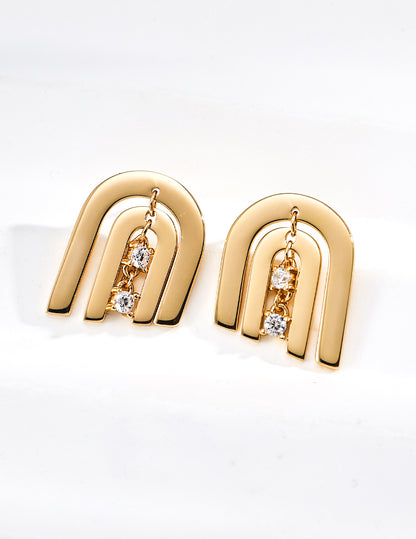 Contemporary CNC precision cut layered arch stud earrings with a central dangling cubic zirconia stone in gold finishes