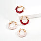 Dare To Sparkle - Vintage gold plated wave hoop earrings featuring half fluid metal and half glossy burgundy red and pearlescent white enamel finishes