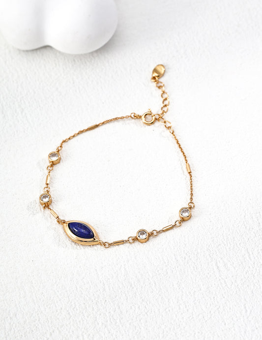 Dare To Sparkle - Elegant vintage gold chain bracelet featuring a central marquise natural deep blue lapis lazuli stone and bezel-set round cz crystals