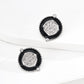 Chinoiserie chic round stud earrings with black enamel borders centering a metallic bamboo relief plaque with micro cz gems in silver