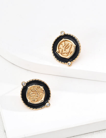 Chinoiserie chic round stud earrings with black enamel borders centering a metallic bamboo relief plaque with micro cz gems in gold