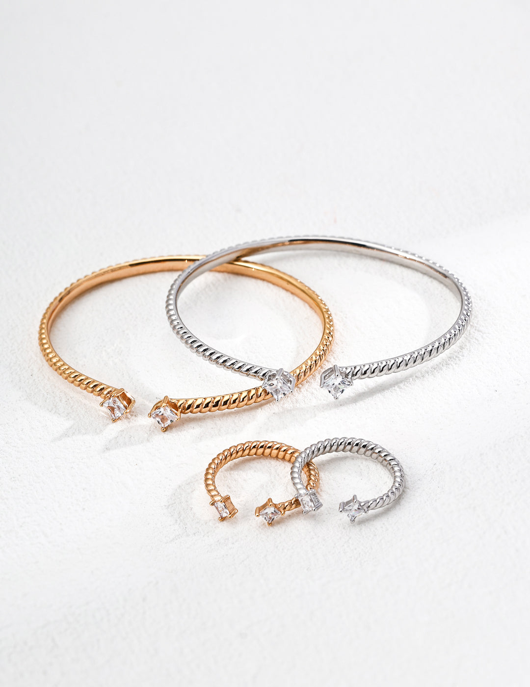 Dare To Sparkle - Contemporary minimalist open-band cuff bracelet and matching ring set in silver and gold finishes featuring radiant prong-set cz gems flanking both open ends