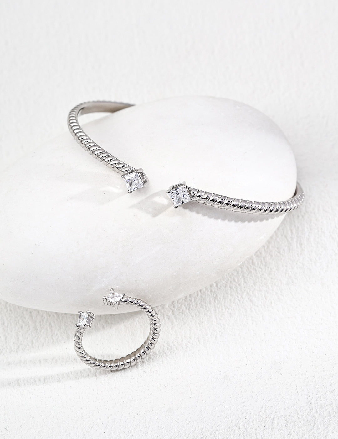 Dare To Sparkle - Contemporary minimalist open-band cuff bracelet and matching ring set in silver finishes featuring radiant prong-set cz gems flanking both open ends