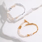 Dare To Sparkle - Avant-garde half-cuff half-strand bracelets featuring organic liquid molten silver and gold metals, a custom fluid OT clasp, and irregular stone-shaped pearls