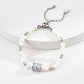 Dare To Sparkle - Luxury natural freshwater pearl strand bracelets featuring a central spinning cylinder charm paved with sparkling cz crystals in silver