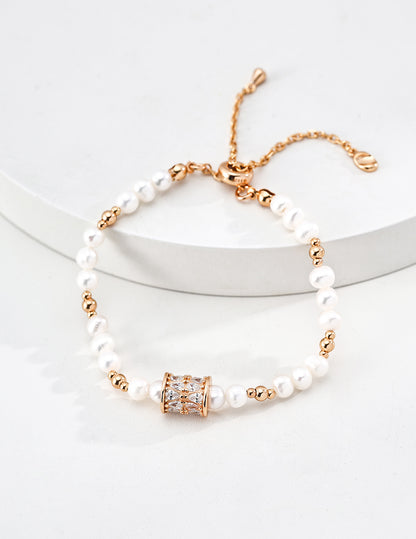 Dare To Sparkle - Luxury natural freshwater pearl strand bracelets featuring a central spinning cylinder charm paved with sparkling cz crystals in gold