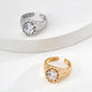 Dare To Sparkle - Luxury high-jewelry style open adjustable rings featuring a large brilliant central cz stone enclosed by a sculptural bubble bezel in silver and gold