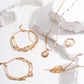 Dare To Sparkle - Avant-garde jewelry set featuring semi-translucent natural opals with shifting blue halos wrapped in fluid molten metal vines in silver and gold