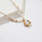 Necklace with an opal pendant on a white background