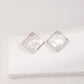 Dare To Sparkle - Statement square stud earrings with a handmade mother-of-pearl mosaic checkerboard pattern and an asymmetric fluid molten metal corner in silver