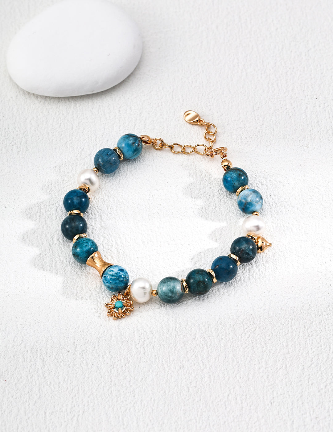 Dare To Sparkle - Elegant 18k gold plated strand bracelet featuring deep blue natural azurite turquoise minerals, lustrous freshwater pearls, and a central star medallion