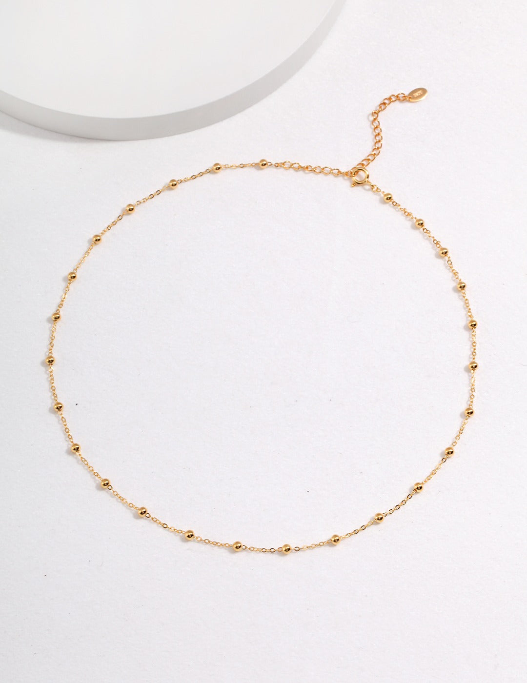 Dare To Sparkle - Versatile high-polished sterling silver faceted bead chains shown with and without a detachable starburst engraved round coin pendant in gold