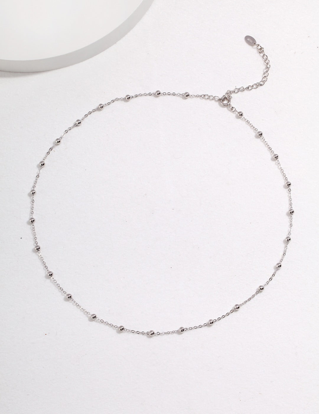 Dare To Sparkle - Versatile high-polished sterling silver faceted bead chains shown with and without a detachable starburst engraved round coin pendant in silver