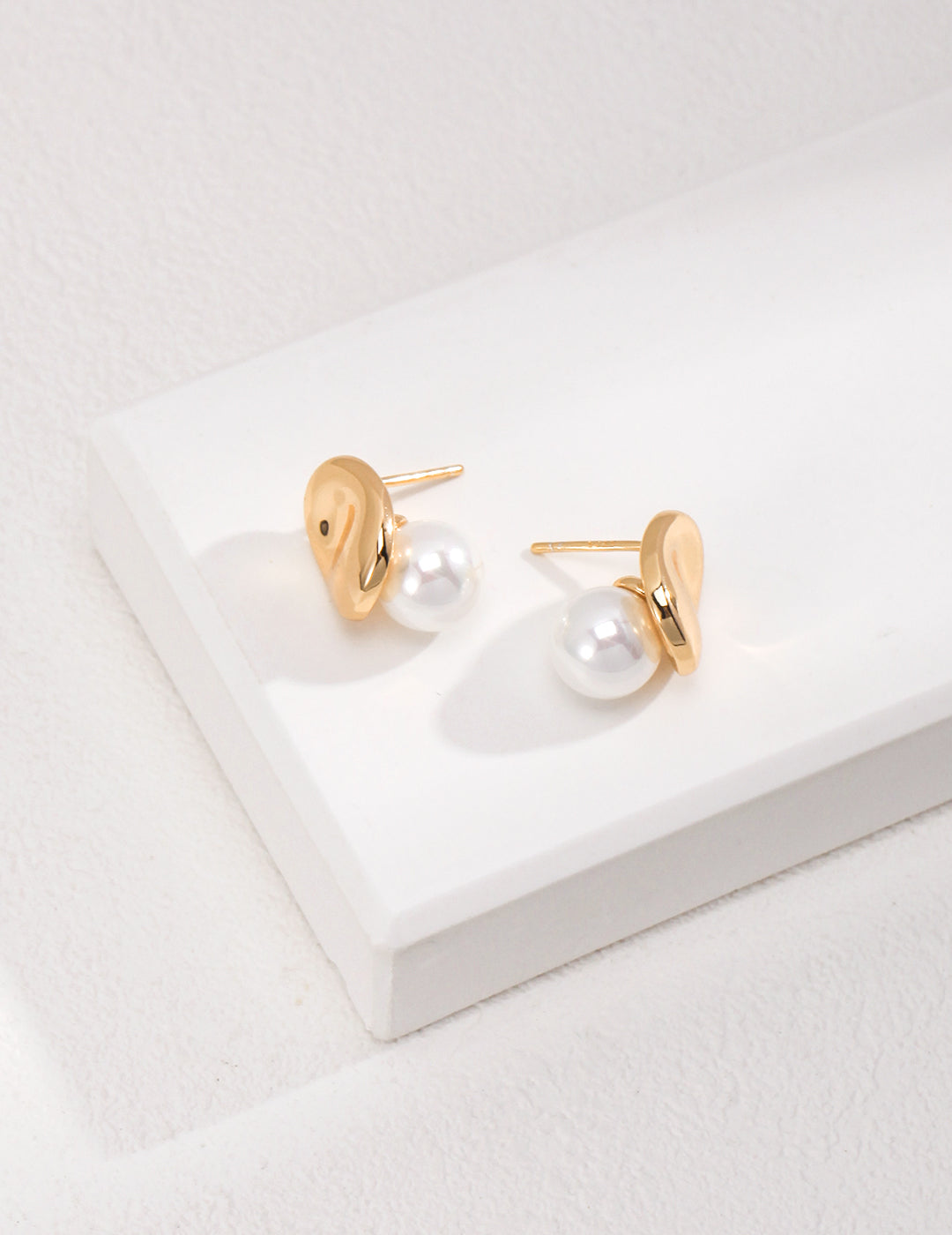 Dare To Sparkle - Avant-garde geometric stud earrings featuring fine deconstructive metallic wire loops and two staggered floating white shell pearls in gold