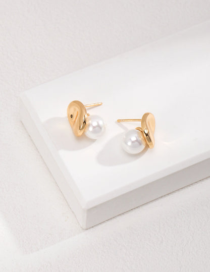 Dare To Sparkle - Avant-garde geometric stud earrings featuring fine deconstructive metallic wire loops and two staggered floating white shell pearls in gold
