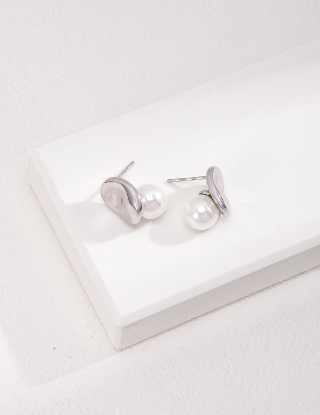 Dare To Sparkle - Avant-garde geometric stud earrings featuring fine deconstructive metallic wire loops and two staggered floating white shell pearls in silver