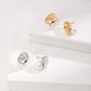Dare To Sparkle - Avant-garde geometric stud earrings featuring fine deconstructive metallic wire loops and two staggered floating white shell pearls in gold and silver