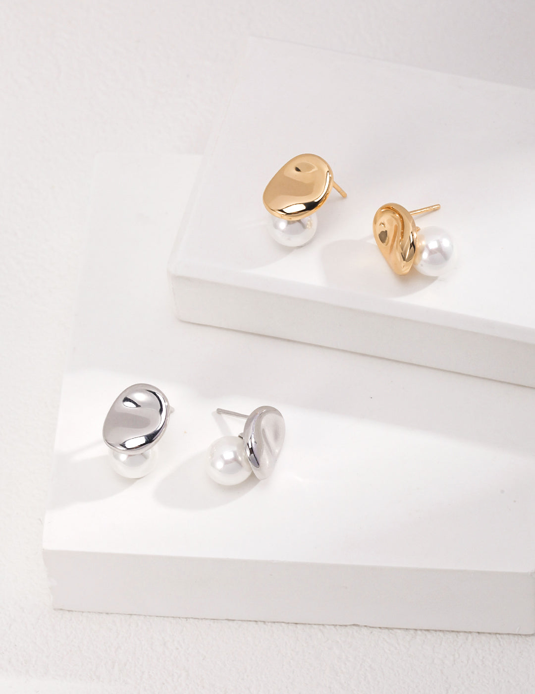 Dare To Sparkle - Avant-garde geometric stud earrings featuring fine deconstructive metallic wire loops and two staggered floating white shell pearls in gold and silver