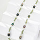 Dare To Sparkle - Art-gallery style beaded strand necklace featuring multi-shaped natural green moss agates, faceted micro beads, and earth-tone stone cylinders