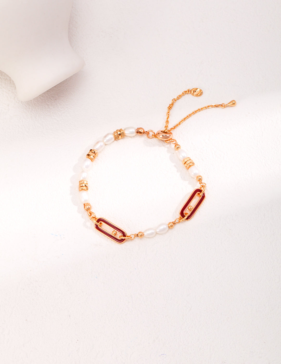 Dare To Sparkle - Luxury 18k gold plated bracelet featuring rice freshwater pearls, crimson red enamel oblong links, and an adjustable chain slider closure