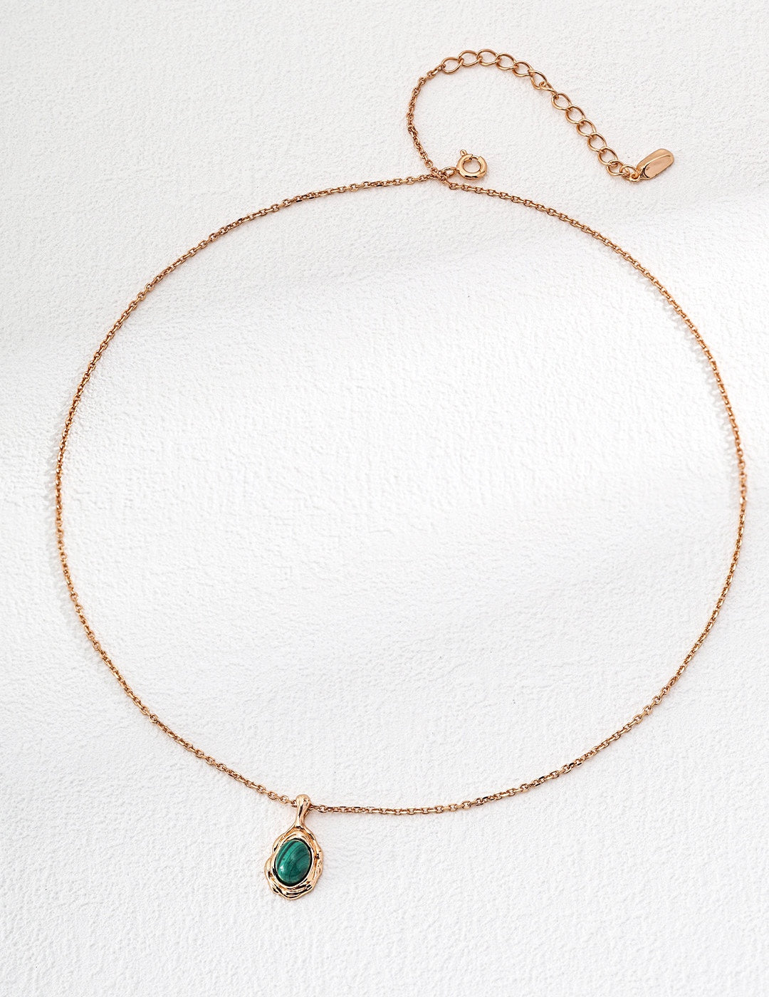 An organic molten gold framed natural malachite pendant necklace