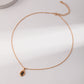 An organic molten gold framed round tiger's eye pendant necklace