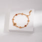 Gold bracelet with gemstones on a white box