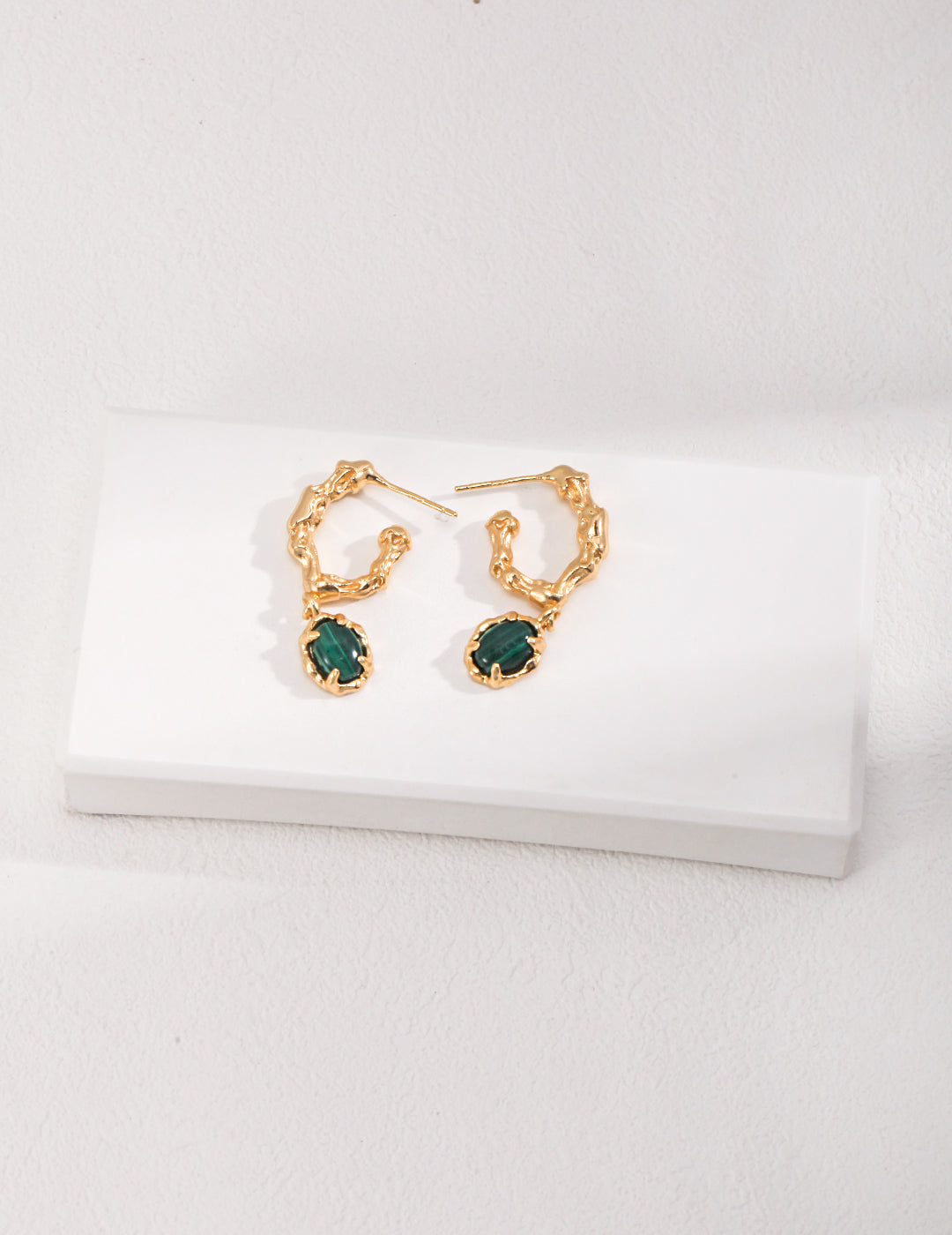Dare To Sparkle - Avant-garde drop earrings featuring organic sculptural 18k gold plated molten c-hoops suspending oval genuine green natural malachite stones