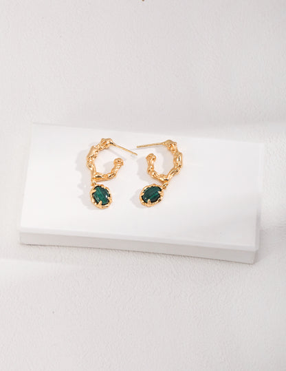 Dare To Sparkle - Avant-garde drop earrings featuring organic sculptural 18k gold plated molten c-hoops suspending oval genuine green natural malachite stones