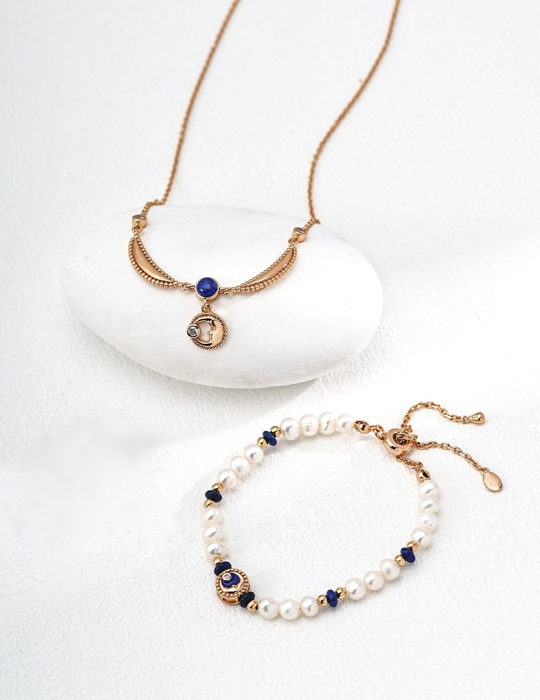 Jewelry set with necklace and bracelet on a white background
